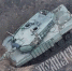 Немецкий танк Leopard 2A4 с комплектом динамической защиты «Контакт-1», застрявший в воронке от авиабомбы около села Победа на Кураховском направлении - Donetsk-News.Ru